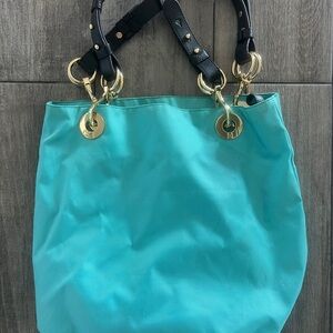 JPK tote with gold hardware and leather details